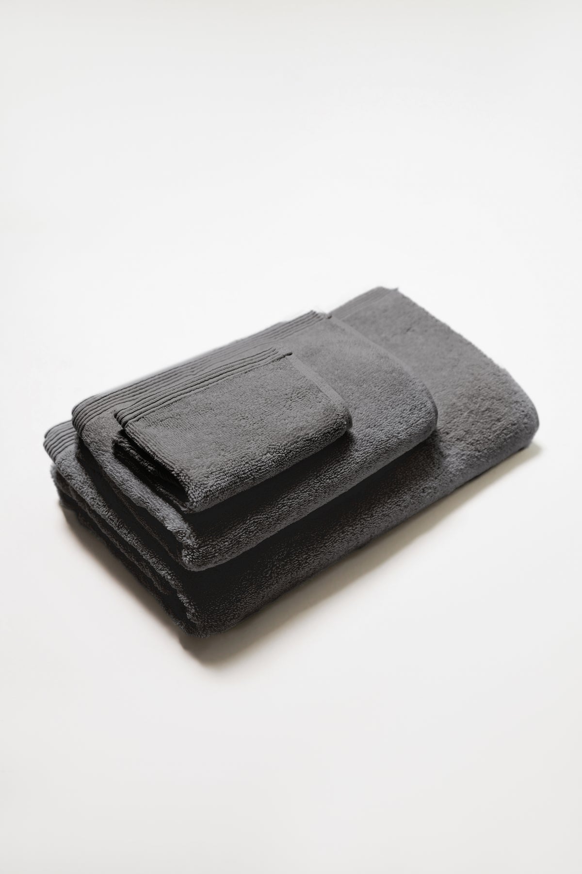 Seine, Bordered Cotton Face Cloth in Charcoal